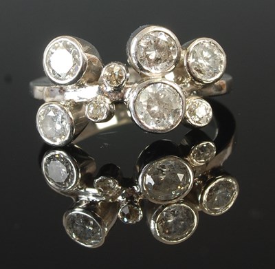 Lot 297A - A platinum rub over set diamond ring, set with...