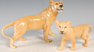 Lot 10 - A Beswick model of a lioness, 14.5cm high;...