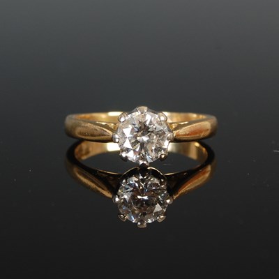 Lot 334 - An 18ct gold and diamond solitaire ring, set...