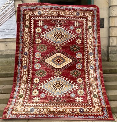 Lot 914 - A machine made red Qashqai carpet, 335cm x 241cm.