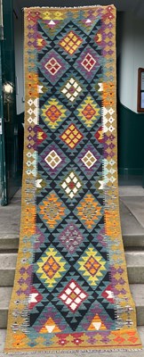 Lot 910 - A Maimana Kilim runner, the green ground...