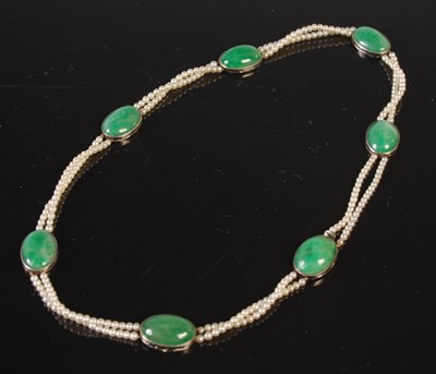Lot 118 - A jade and seed pearl two strand choker...