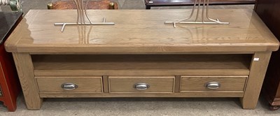 Lot 704 - A modern TV console table in whitewash oak...