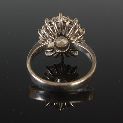 Lot 344 - A platinum and diamond set cluster ring,...