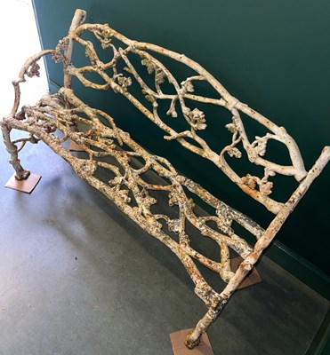 Lot 872 - A cast iron branch form garden bench, 129cm...