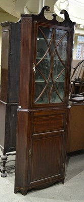 Lot 639 - A 19th century mahogany corner cabinet with...