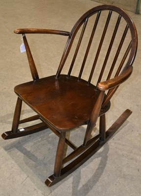 Lot 821 - A mid-century Ercol child's rocking chair with...