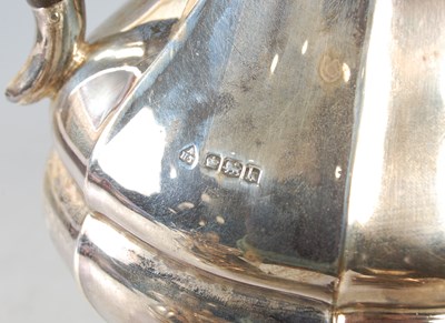 Lot 72 - A Sheffield silver four piece tea set...