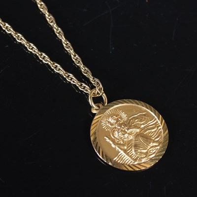 Lot 201 - A 9ct gold St Christopher pendant suspended on...