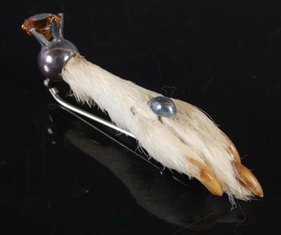 Lot 173 - A white metal mounted claw brooch, 79.5mm long.