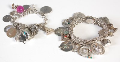 Lot 214 - Two white metal charm bracelets and a bag of...