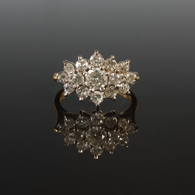 Lot 259 - An 18ct gold and diamond cluster ring, set...