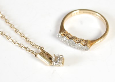 Lot 273 - A yellow and white metal five stone diamond...