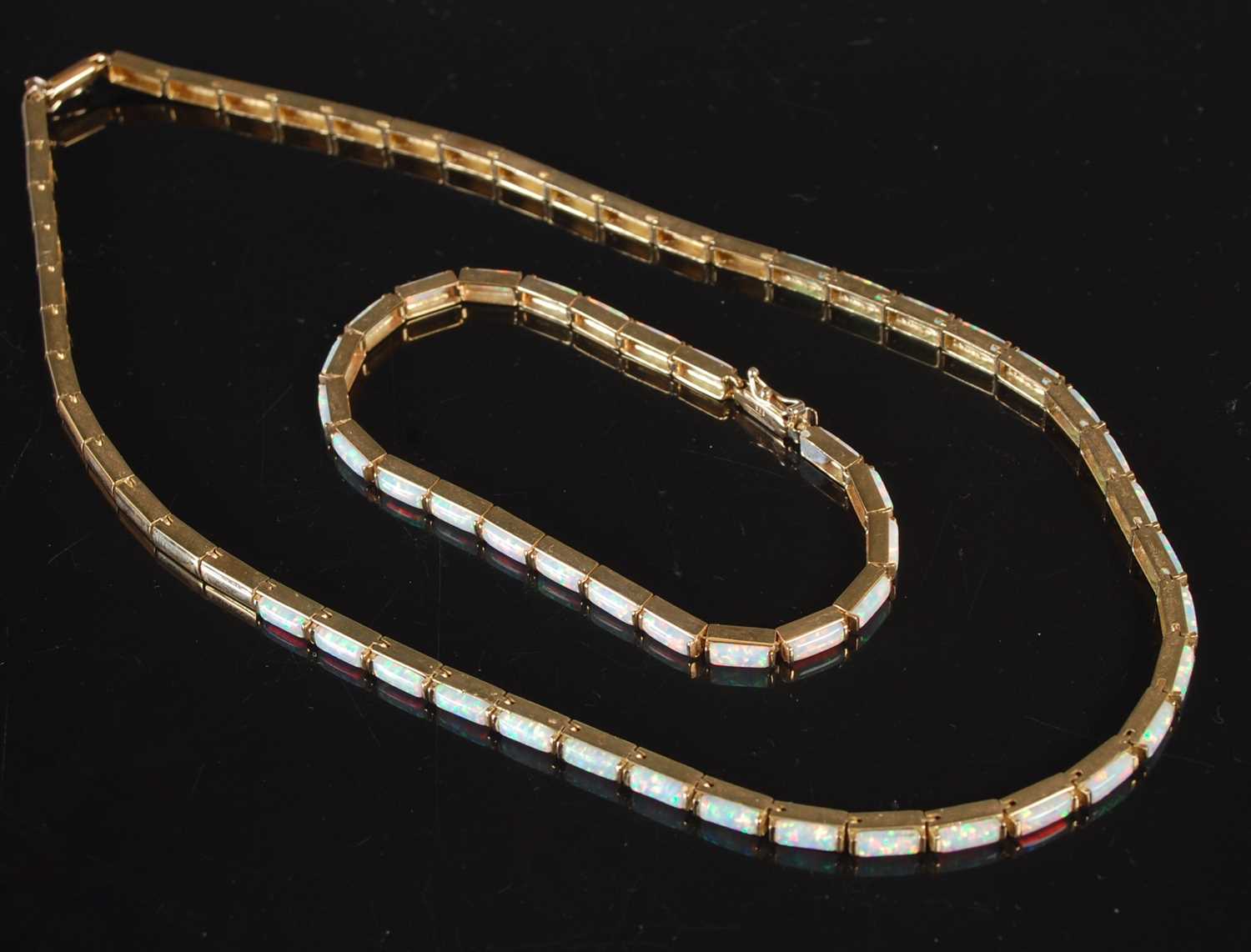 Lot 293 - A 14ct gold and opal articulated necklace;...