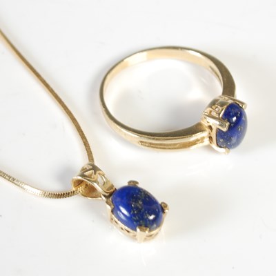 Lot 304 - A 14ct gold and lapis lazuli single cabochon...