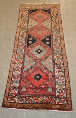 Lot 772 - A Persian Hamadan runner, the rectangular...