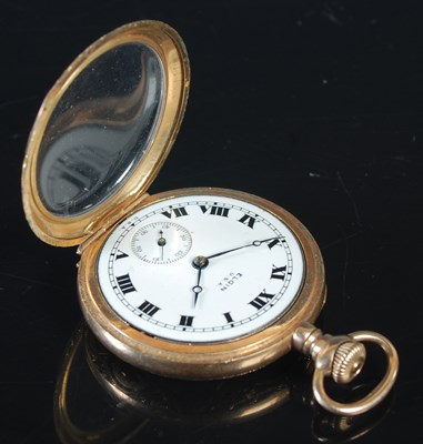 Lot 16 - An unmarked yellow metal cased open faced fob...