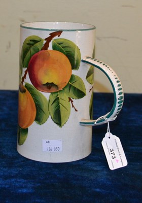 Lot 373 - A Wemyss Pottery mug decorated with apples,...