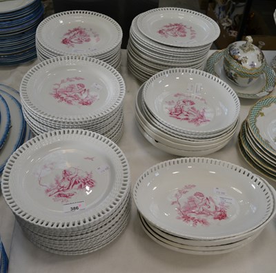 Lot 386 - A Minton part dinner service with puce printed...