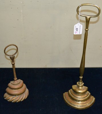 Lot 431 - A 19th century brass door porter with a three...