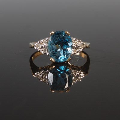 Lot 188 - A 9ct gold blue topaz and diamond set cocktail...
