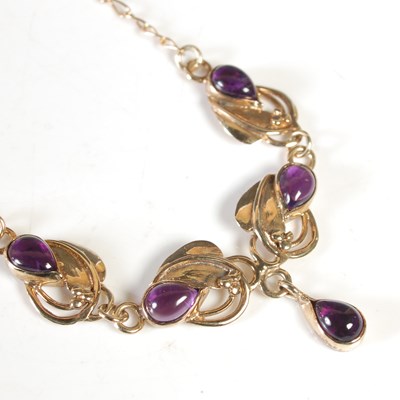 Lot 208 - A 9ct gold and amethyst cabochon set Art...