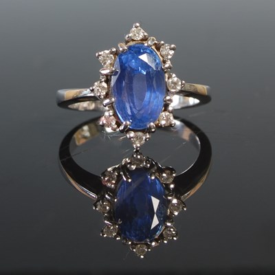 Lot 260 - A white metal sapphire and diamond cluster...