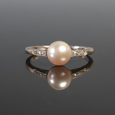 Lot 263 - A white metal pearl and diamond chip ring, the...
