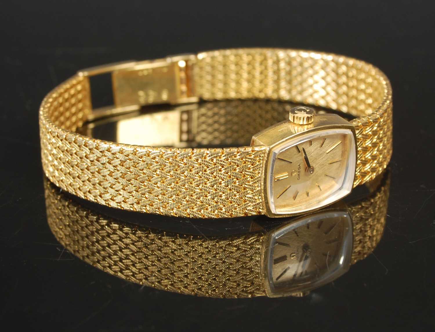 Lot 9 - A vintage ladies Omega 18ct gold bracelet...
