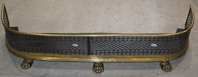 Lot 665 - A 19th century brass and iron fire fender,...