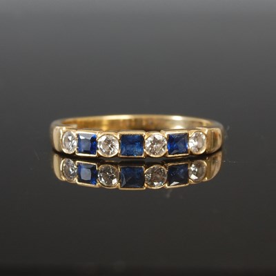 Lot 263I - An 18ct gold sapphire and diamond half hoop...