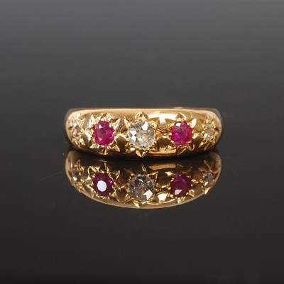 Lot 263K - An 18ct gold diamond and ruby set five stone...