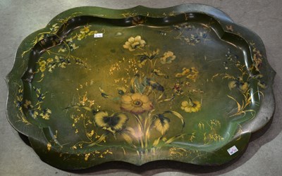 Lot 1168 - A large 19th century toleware green ground...