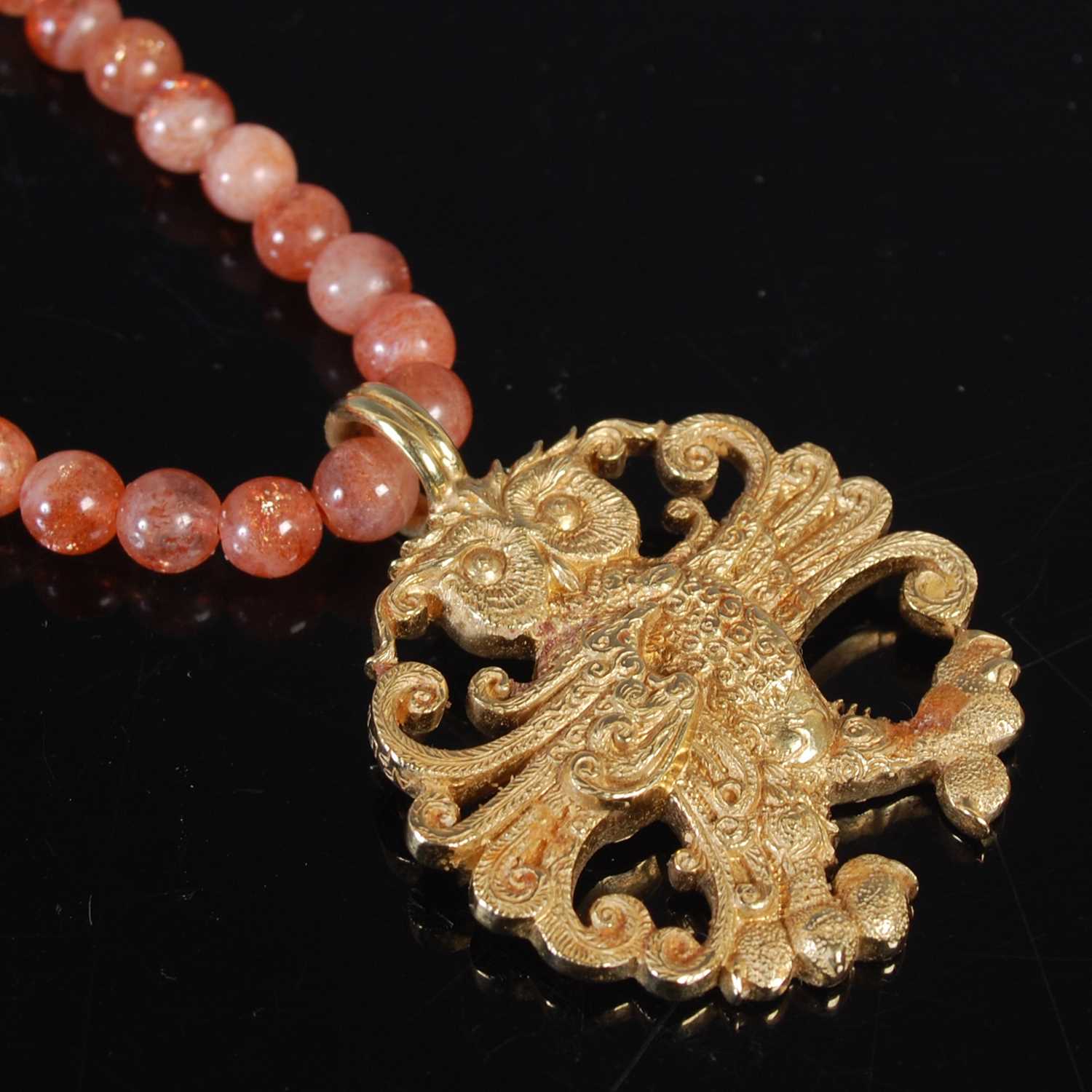 Lot 12 - Malcolm Appleby, an 18ct gold owl pendant,...