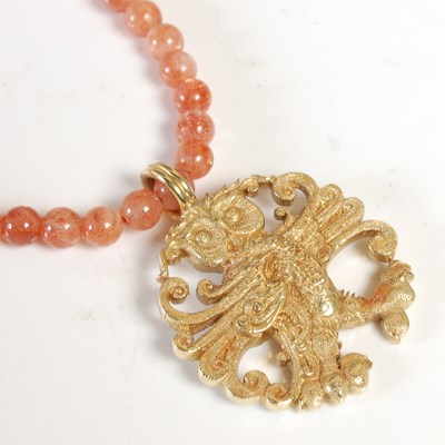 Lot 12 - Malcolm Appleby, an 18ct gold owl pendant,...