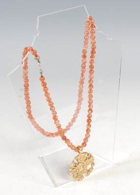 Lot 12 - Malcolm Appleby, an 18ct gold owl pendant,...