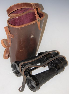 Lot 283 - A vintage leather cased set of binoculars,...