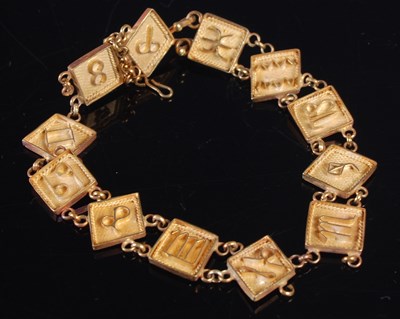 Lot 236 - A yellow metal zodiac panel bracelet (some...