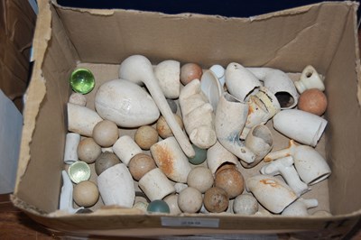 Lot 295 - A box containing various parts of clay pipes,...