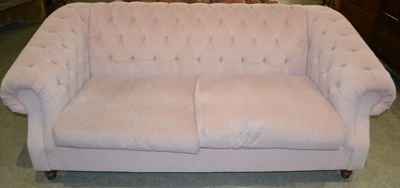 Lot 856 - A Long Eaton button back two seater sofa in...