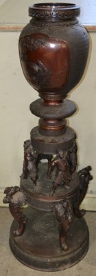 Lot 493 - A Japanese bronze two sectional floor vase,...