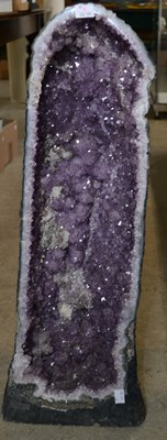 Lot 327B - An amethyst geode specimen, with a deep purple...