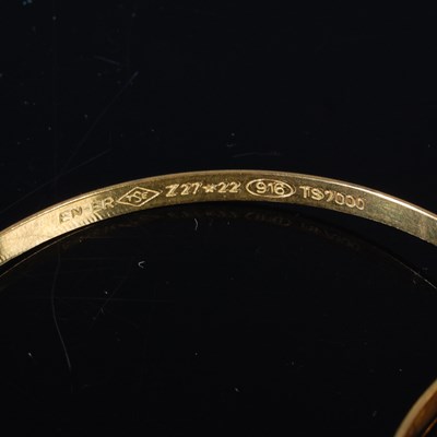 Lot 25 - Six high carat gold bangles, all stamped '22',...