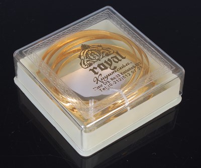 Lot 25 - Six high carat gold bangles, all stamped '22',...