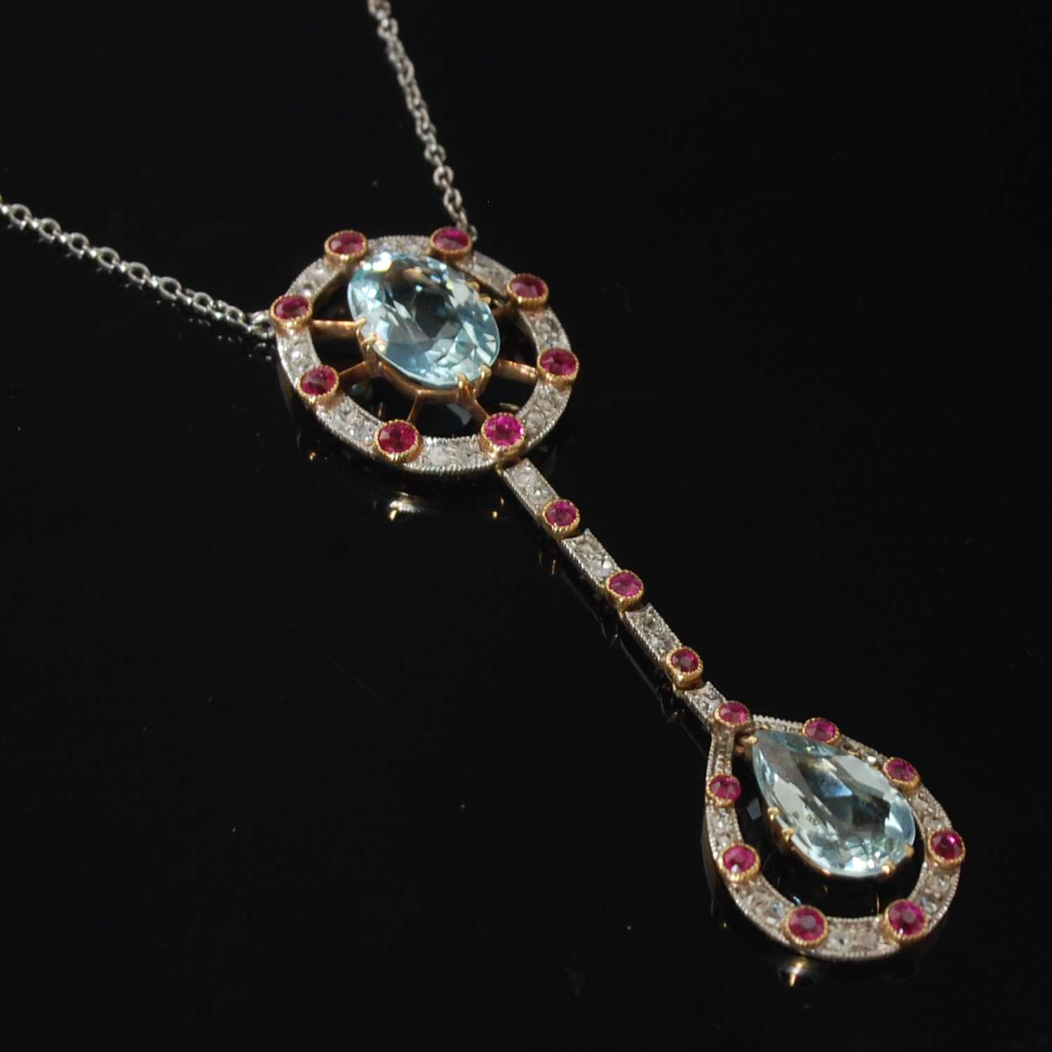 Lot 331 - An Edwardian yellow and white metal aquamarine...