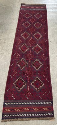 Lot 664 - A Meshwani runner, worked in madder blue and...