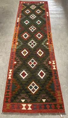 Lot 672 - A Maimana Kilim runner, worked in green,...