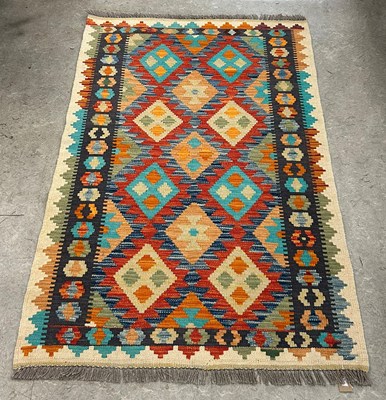 Lot 671 - A Chobi Kilim rug, worked in blue, green,...