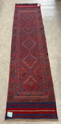 Lot 666 - A Meshwani runner, worked in blue, madder,...
