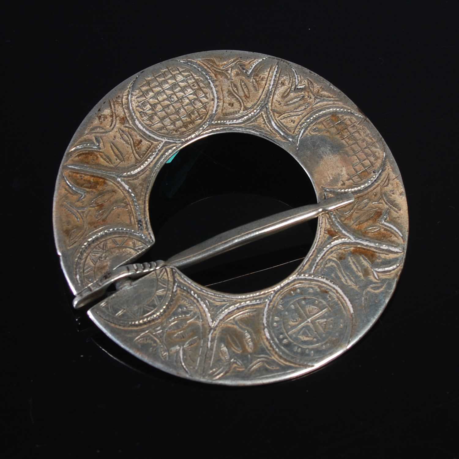 Lot 147 - An 18th century Scottish white metal plaid...